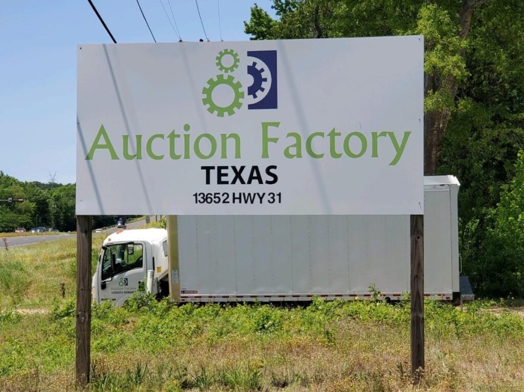 Auction Factory Texas road sign
